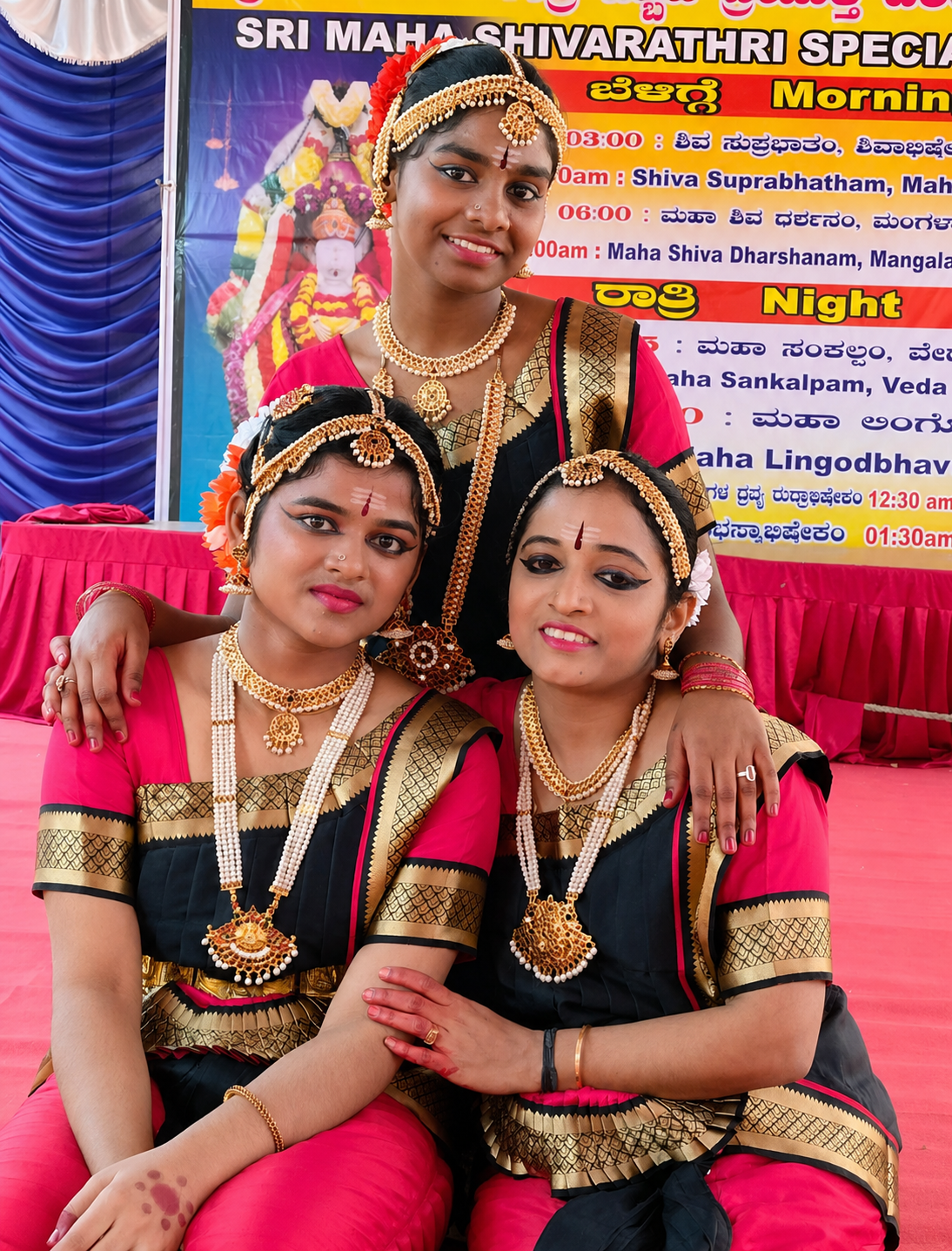 Bharatanatyam dancer in white costume performing with stage lighting