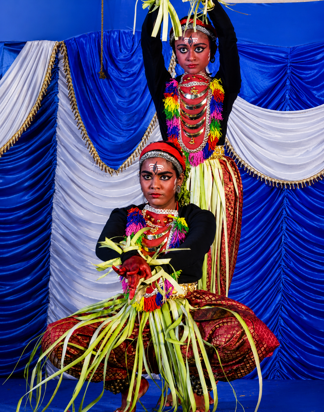 Bharatanatyam dancer in green costume showing hand mudras